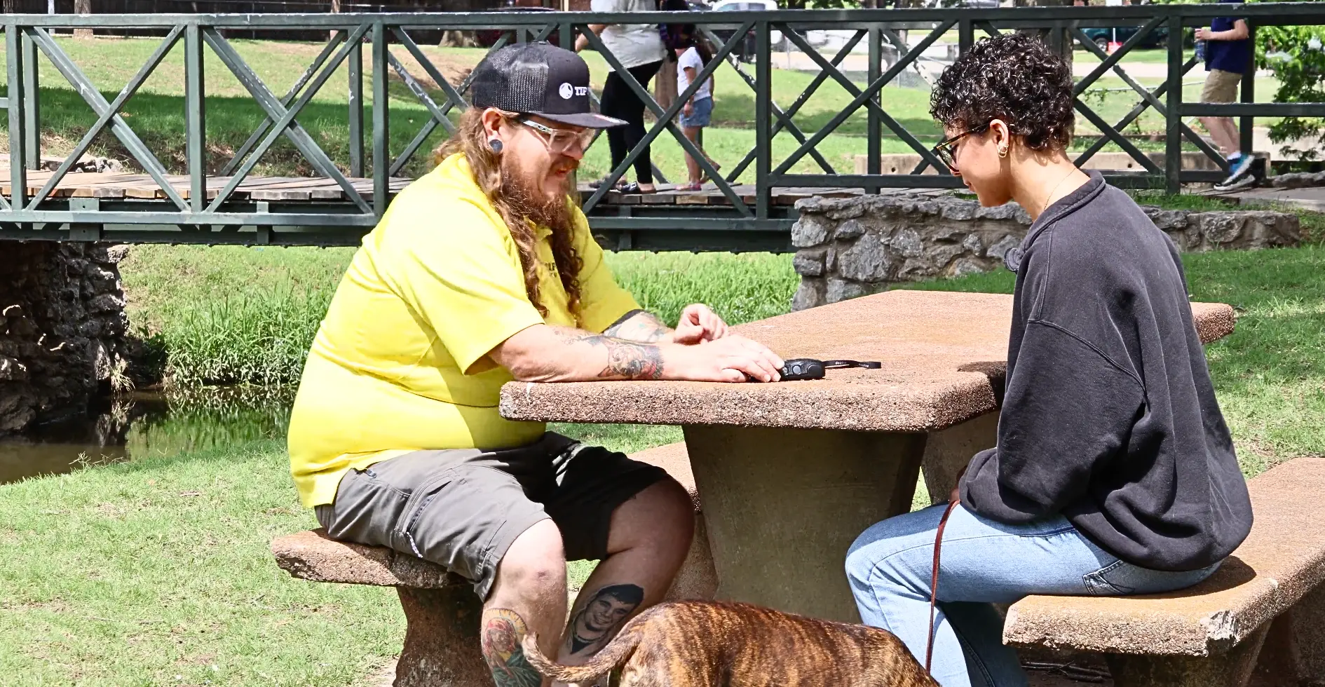 Joseph, lead trainer at Tip Top K9 Kansas City, working with a client and their dog